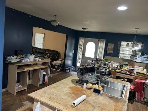 a room with gym equipment and a view of living room