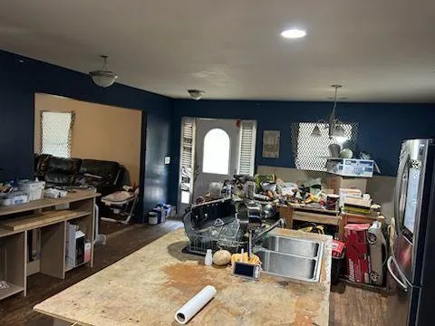 a room with furniture a rug and a flat screen tv