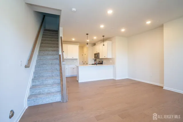 a view of kitchen and kitchen with wooden floor