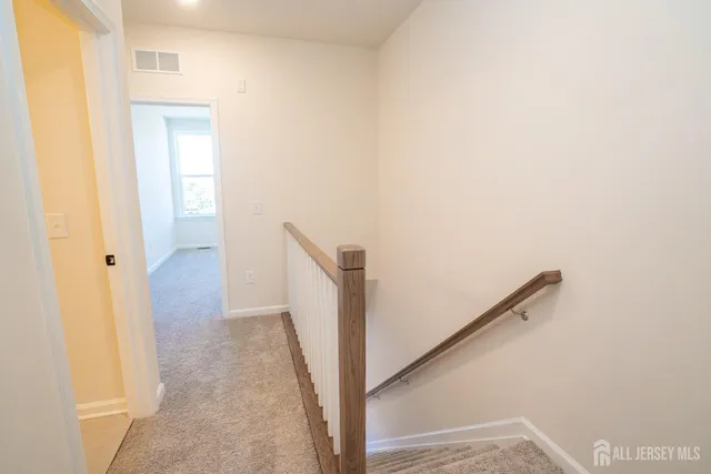 a view of a hallway with staircase