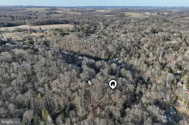 an aerial view of house with yard