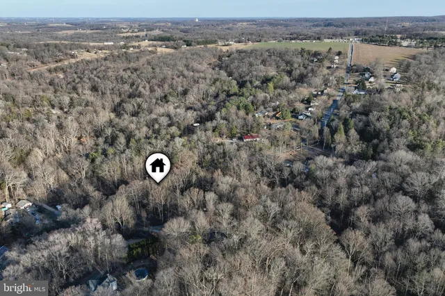 an aerial view of a house with a outdoor space