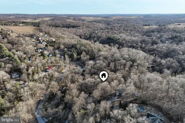 an aerial view of house with yard