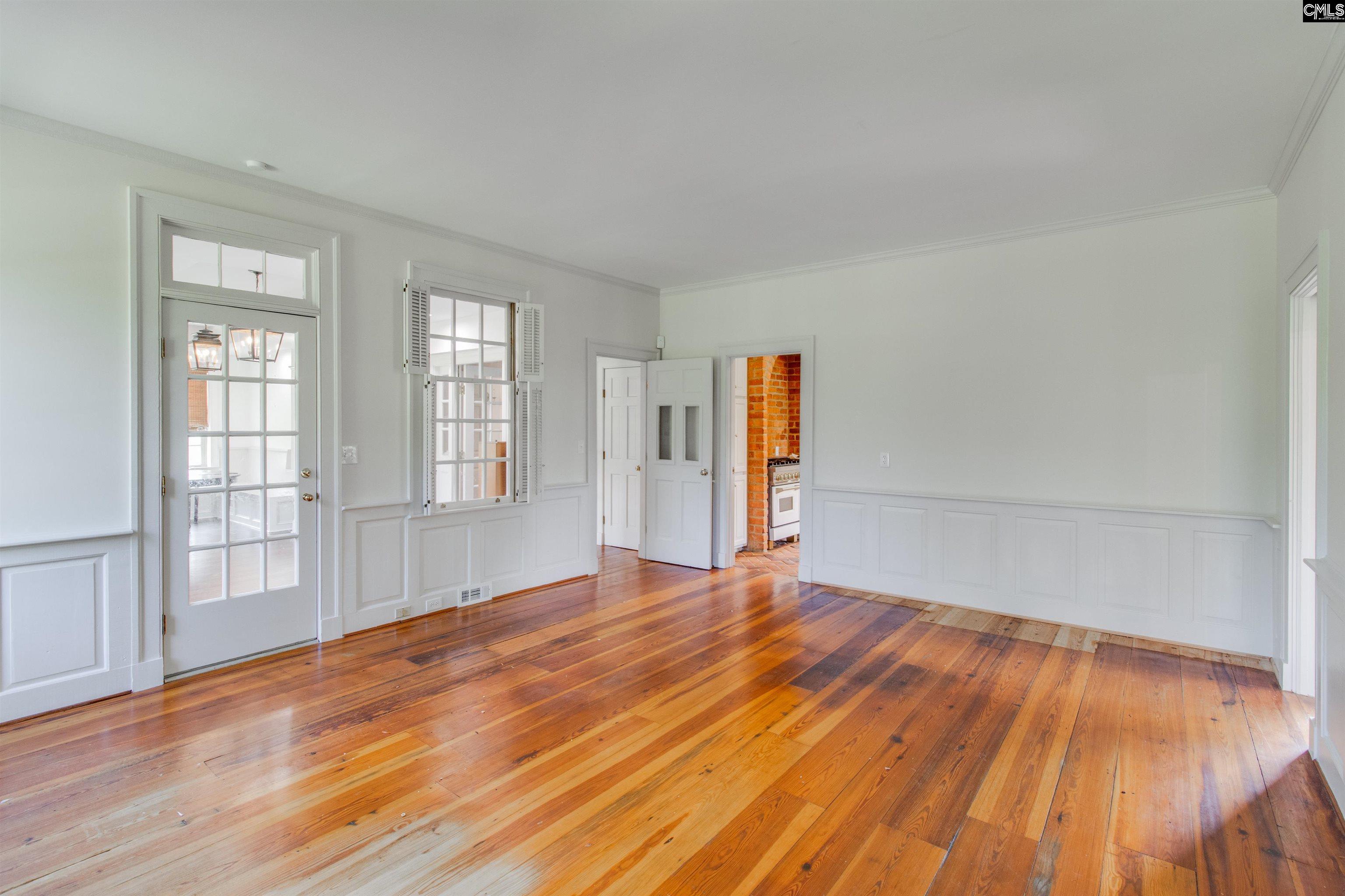 701 Longtown Road Columbia, SC 29229 - Photo 16 of 26 a view of an empty room with wooden floor and windows
