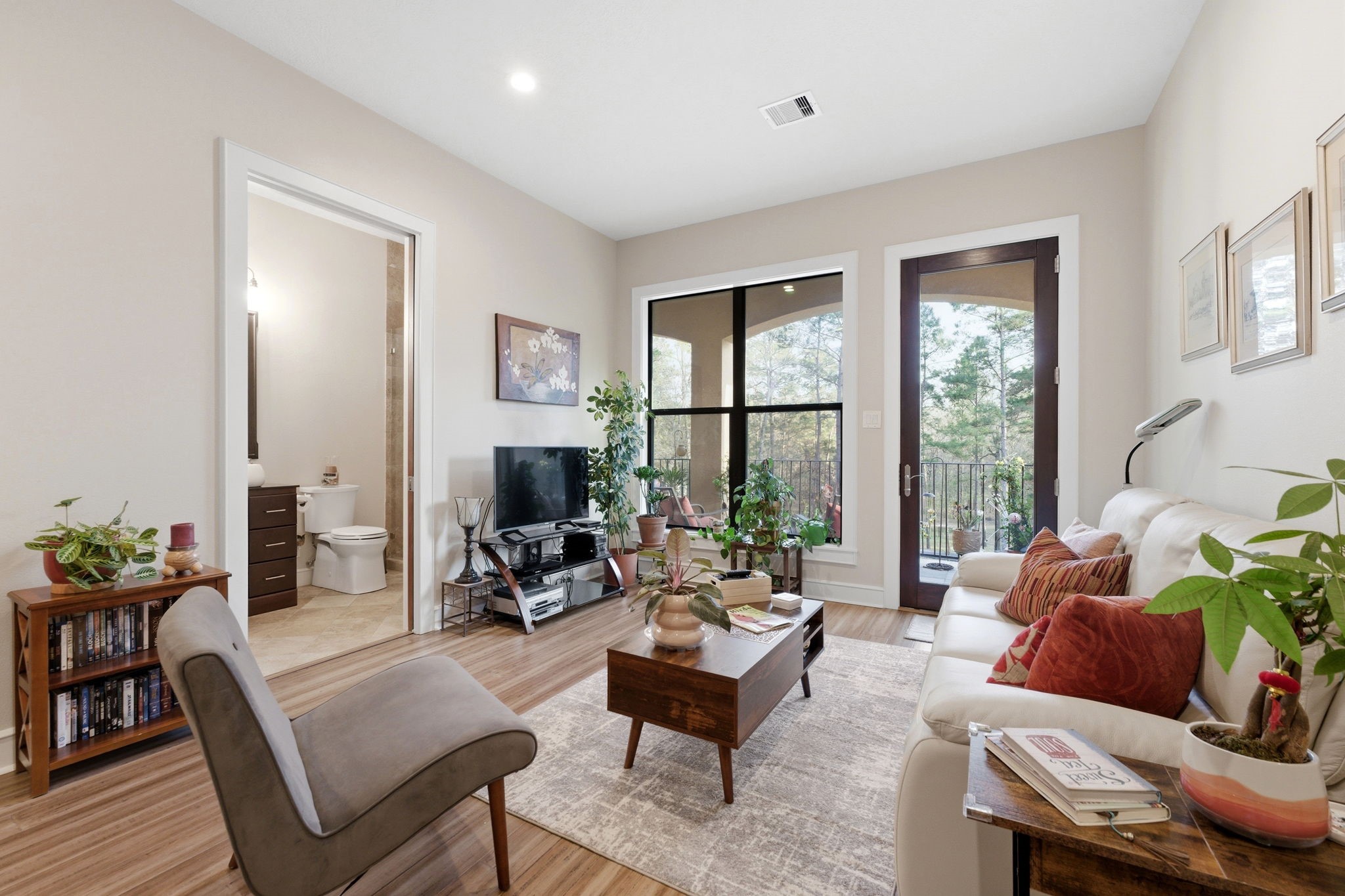 280 Sundog Road Huntsville, TX 77340 - Photo 32 of 50 a living room with furniture and a large window