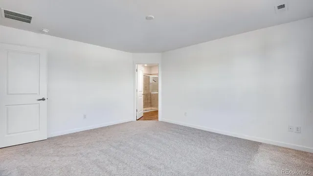 a view of an empty room and entryway