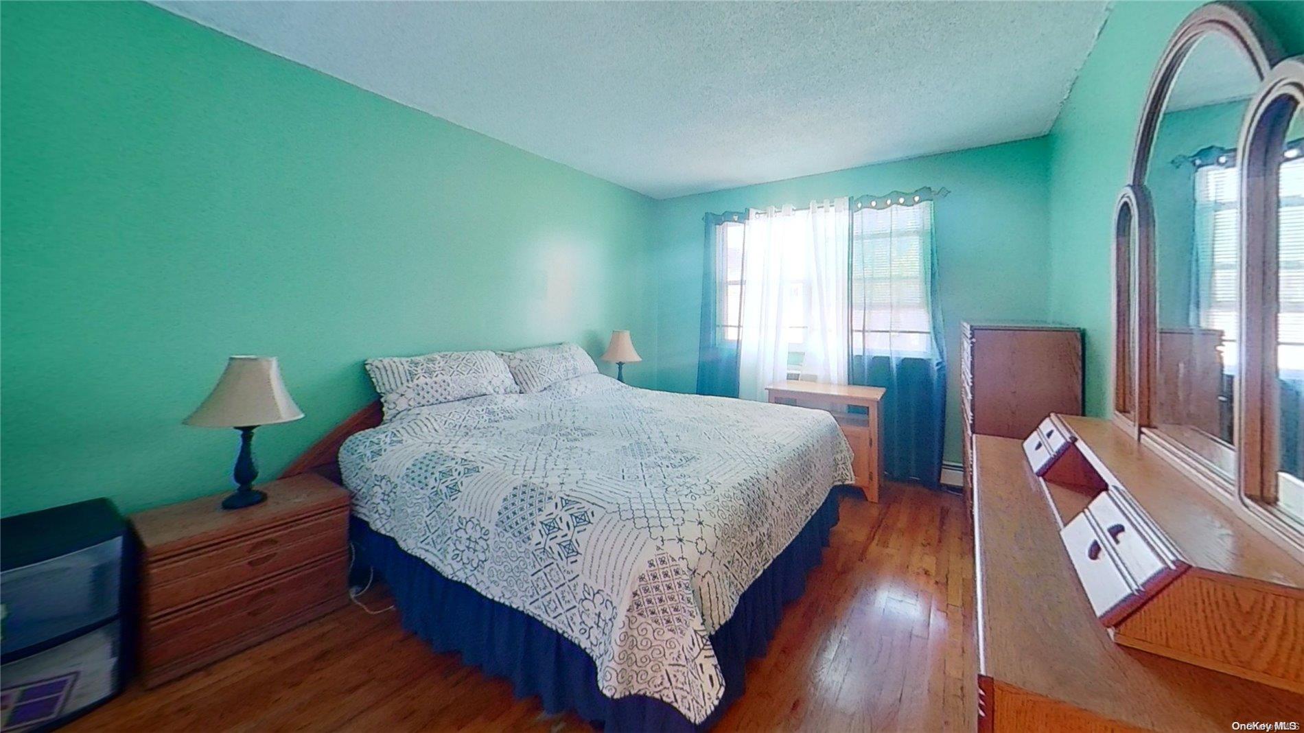 610 Pine Street Brooklyn, NY 11208 - Photo 10 of 35 a bed room with a bed and a chair