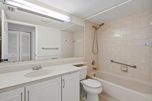 a bathroom with a sink a toilet and a bathtub