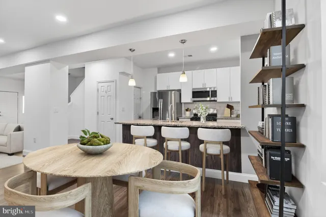 a view of a dining room with furniture and wooden floor