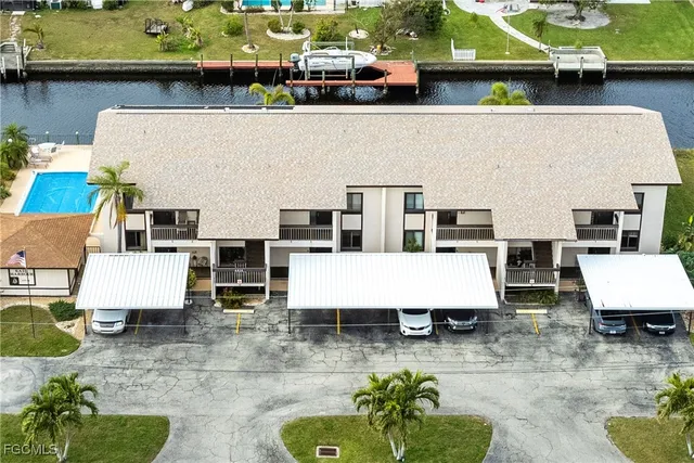 an aerial view of a house with garden space and sitting area