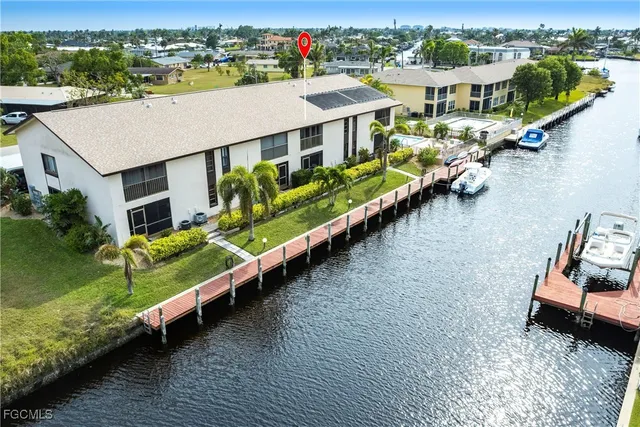 an aerial view of a house with a ocean view