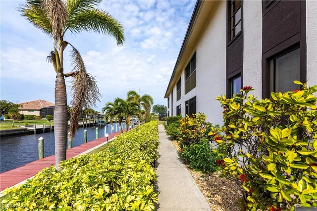 a view of a swimming pool with a yard