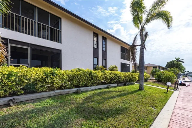 an aerial view of a house with a lake view