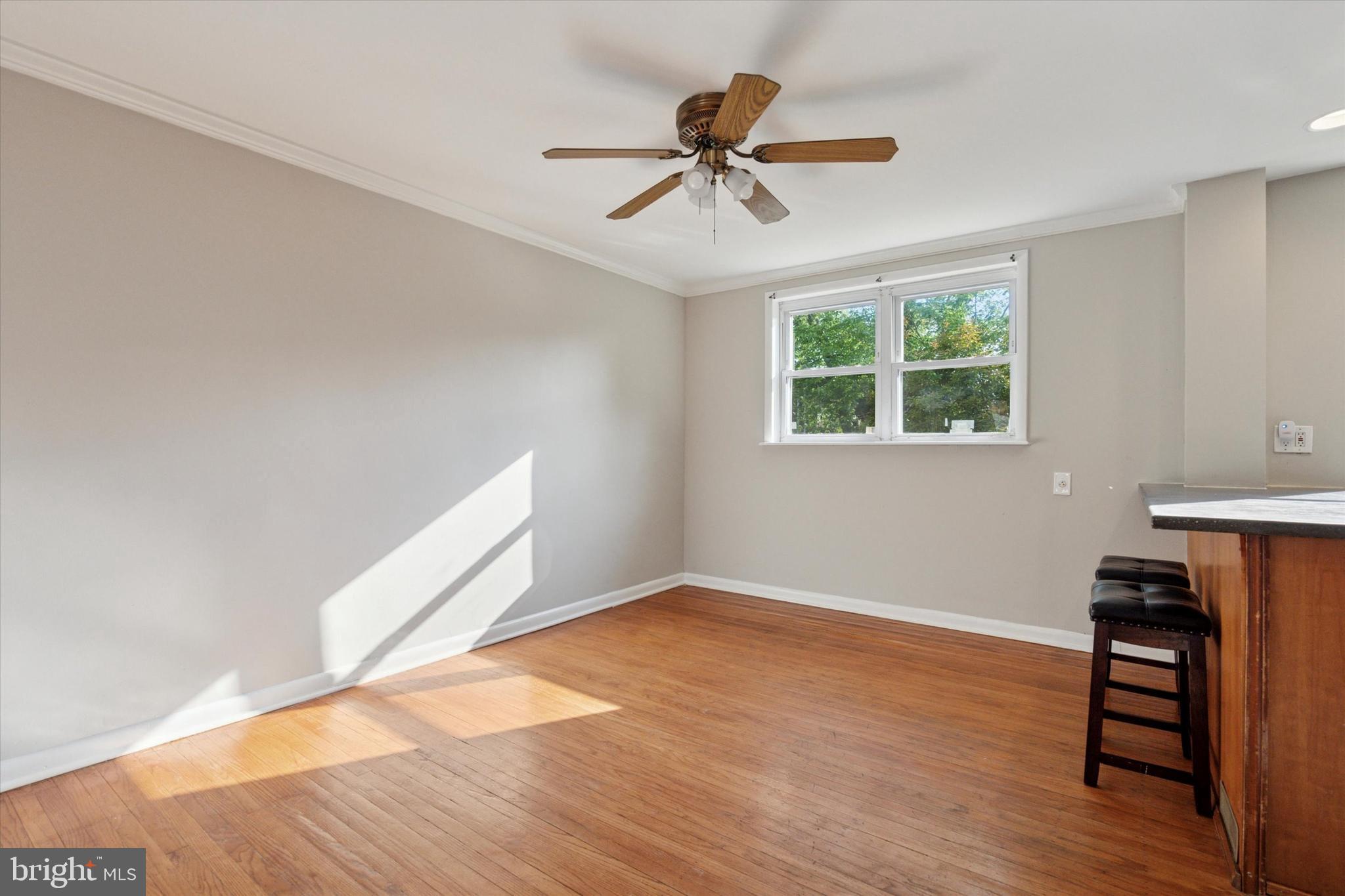 1518 Elson Road Brookhaven, PA 19015 - Photo 10 of 25 a view of an empty room with wooden floor and a window