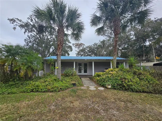 front view of a house with a garden
