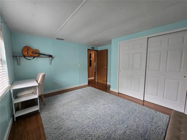 a view of workspace and bedroom