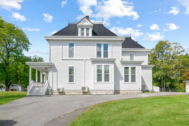a front view of a house with a garage