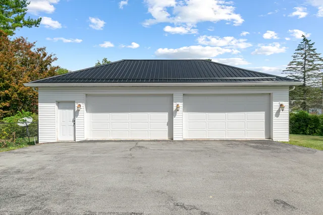 a view of a house with wooden deck