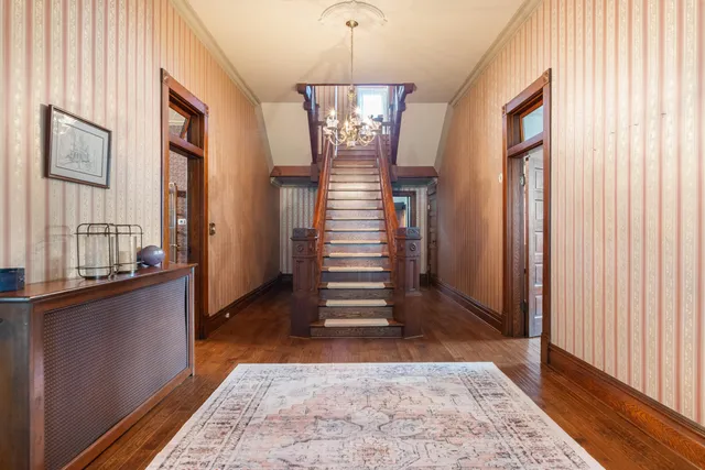 a bedroom with bed and flat screen tv