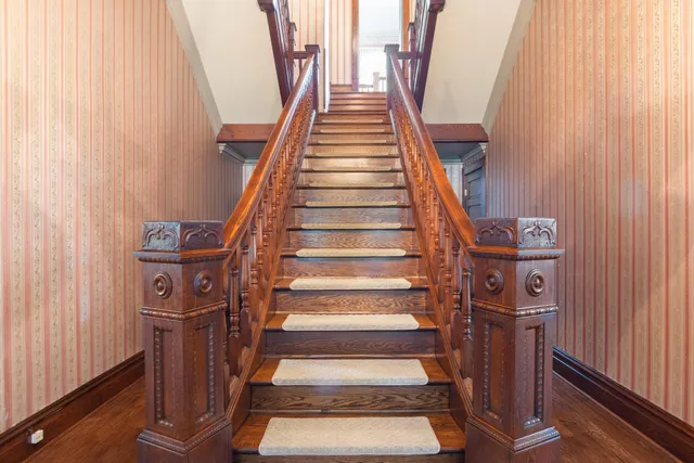 a bedroom with a bed dresser and a walk in closet