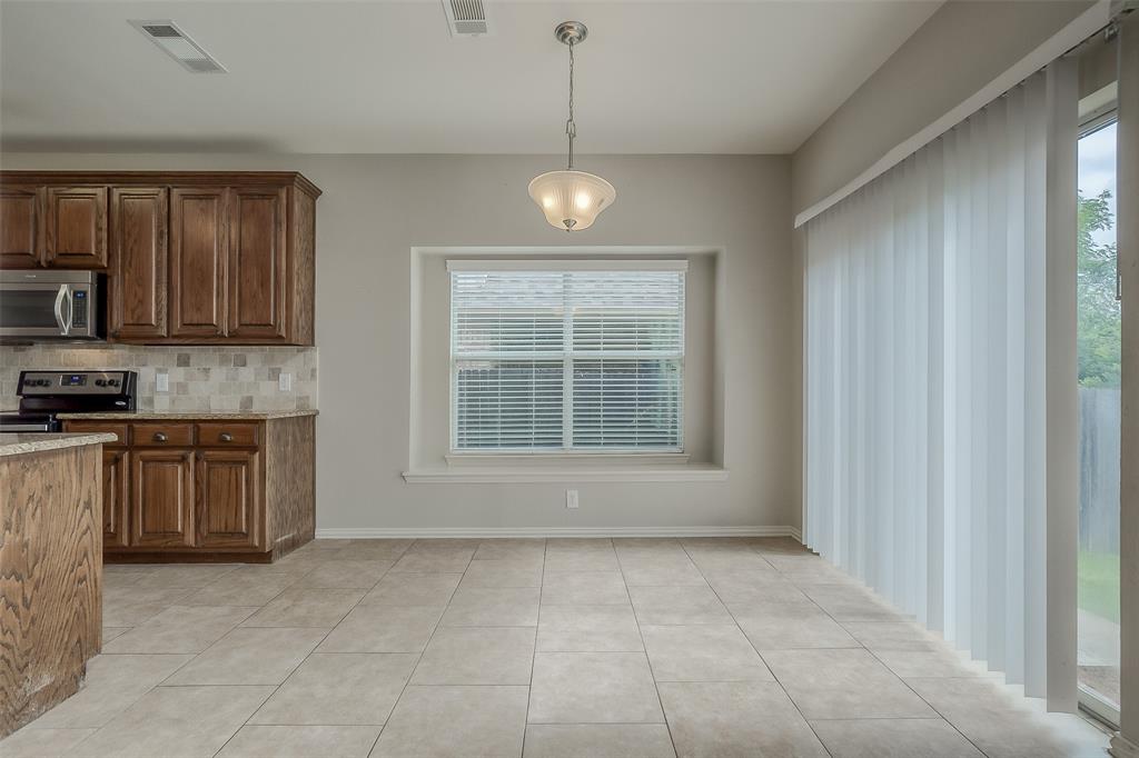 3100 Crossridge Drive McKinney, TX 75071 - Photo 12 of 40 a view of an empty room with a kitchen