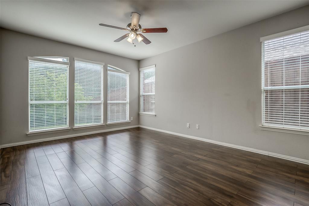 3100 Crossridge Drive McKinney, TX 75071 - Photo 16 of 40 a view of an empty room with wooden floor and a window