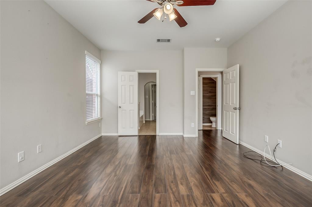 3100 Crossridge Drive McKinney, TX 75071 - Photo 17 of 40 wooden floor in an empty room with a window