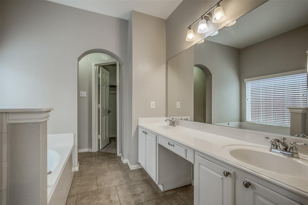 3100 Crossridge Drive McKinney, TX 75071 - Photo 18 of 40 a spacious bathroom with a double vanity sink and a mirror