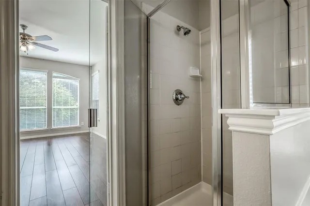a bathroom with a shower and a sink