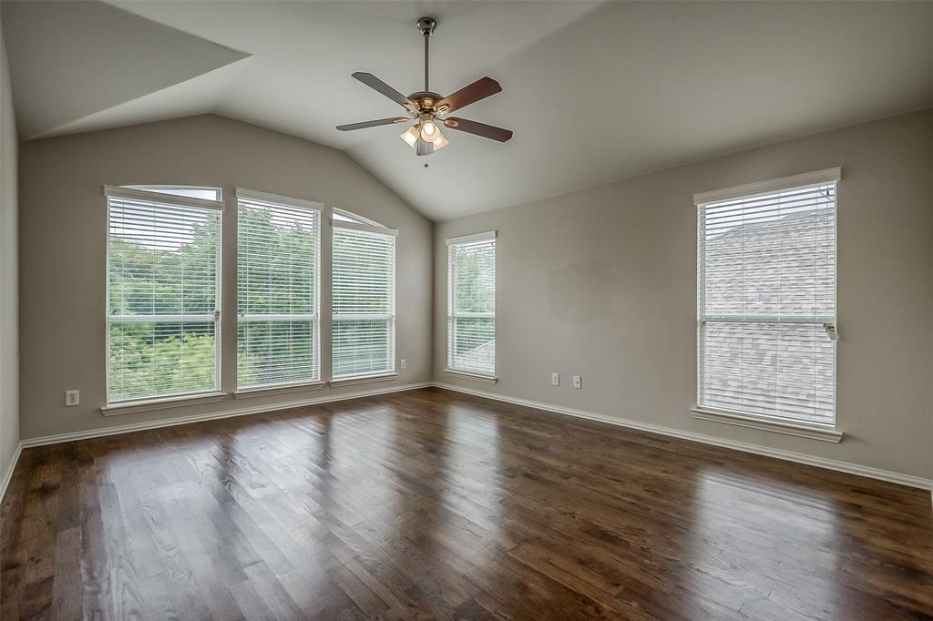 3100 Crossridge Drive McKinney, TX 75071 - Photo 23 of 40 a view of an empty room with wooden floor and a window