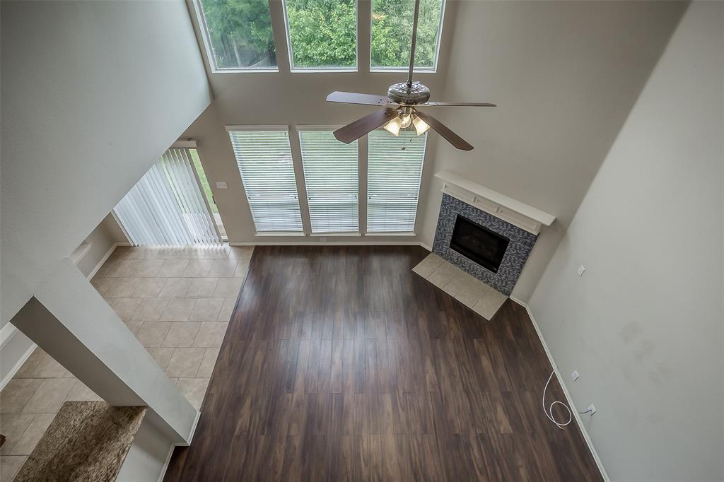 3100 Crossridge Drive McKinney, TX 75071 - Photo 35 of 40 a living room with furniture and a fireplace