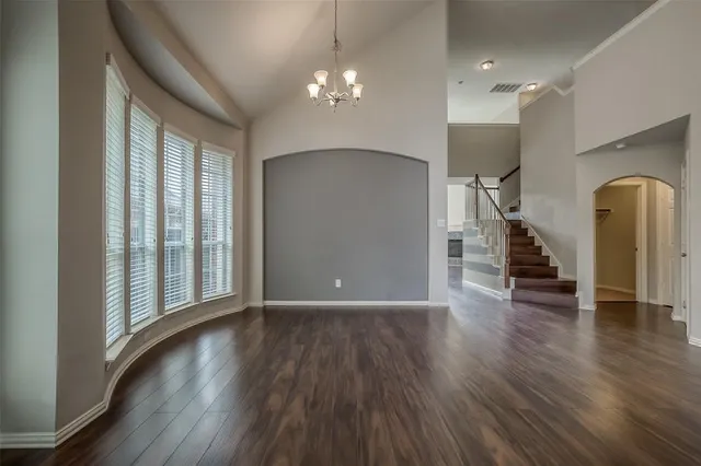 a view of a room with wooden floor and stairs