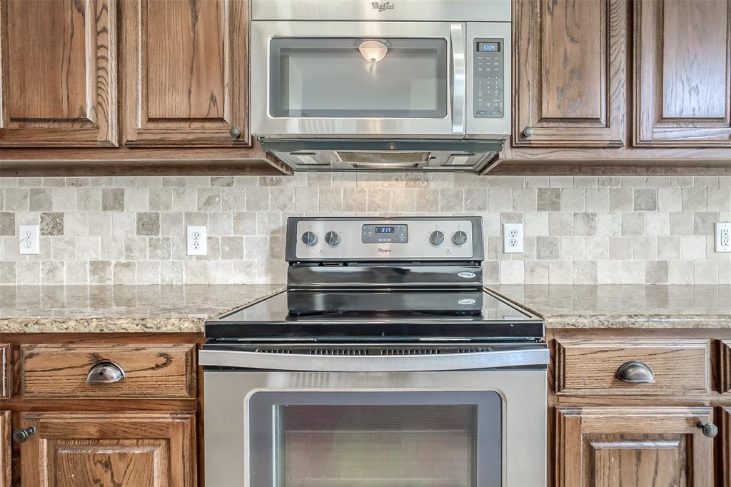 3100 Crossridge Drive McKinney, TX 75071 - Photo 10 of 40 a stove top oven sitting inside of a kitchen