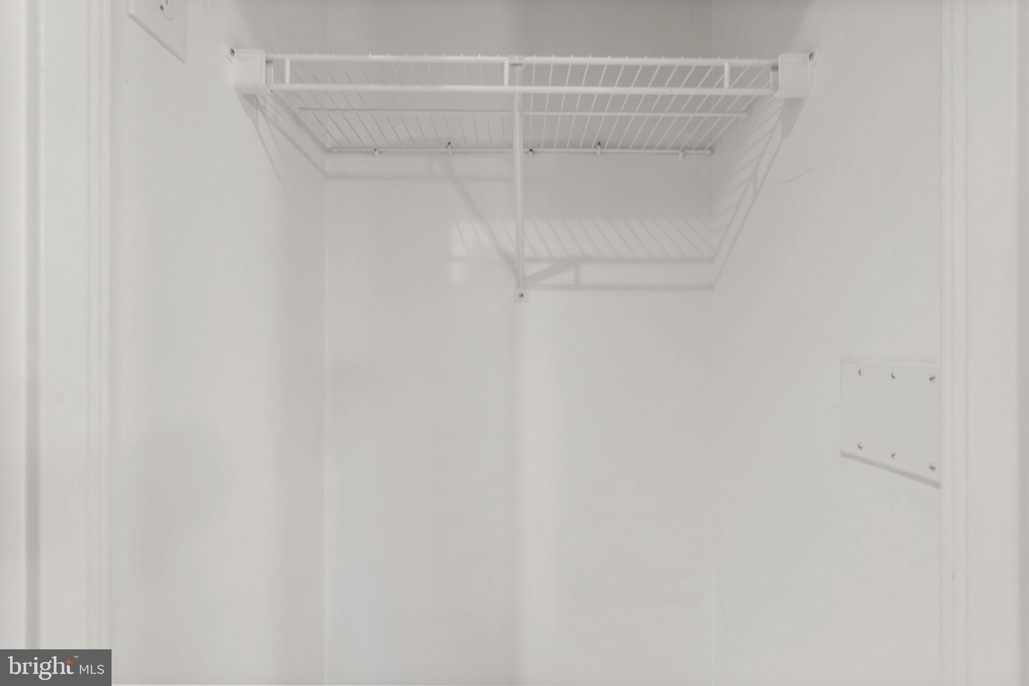 2001 15th Street North, Unit 813 Arlington, VA 22201 - Photo 15 of 31 a view of a room with racks on the wall