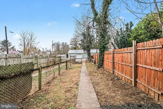 a view of a balcony with wooden floor and fence