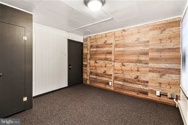 a view of an empty room with shelves
