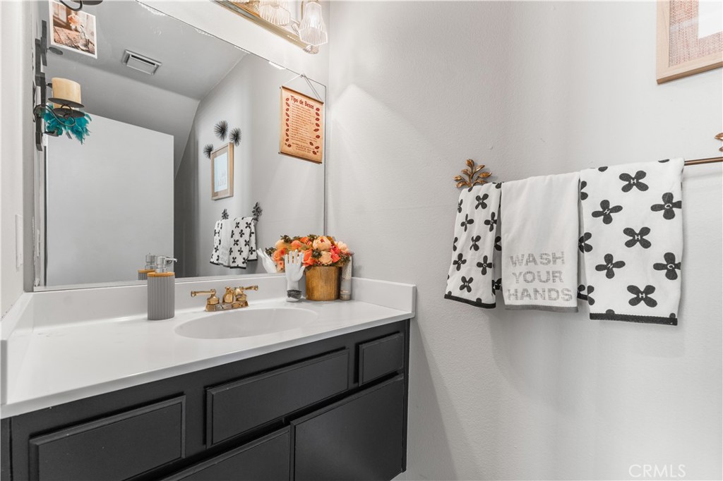 12331 Carl Street Pacoima, CA 91331 - Photo 14 of 28 a bathroom with a sink and a mirror