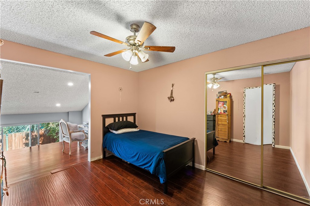 12331 Carl Street Pacoima, CA 91331 - Photo 15 of 28 a view of a livingroom with furniture and wooden floor