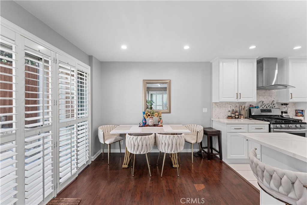 12331 Carl Street Pacoima, CA 91331 - Photo 8 of 28 a dining room with furniture and wooden floor