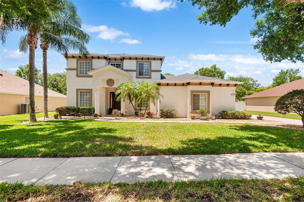 a view of a house with a backyard