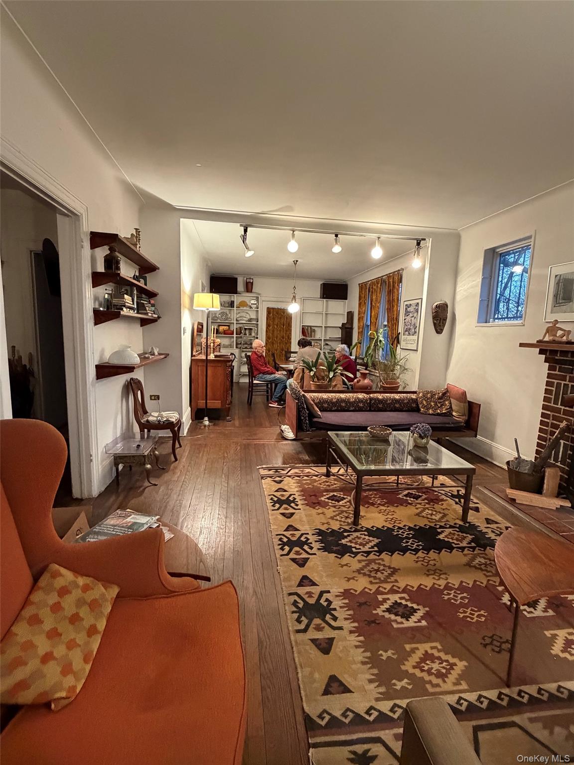 6004 Netherland Avenue Bronx, NY 10471 - Photo 12 of 30 a living room with furniture and a flat screen tv