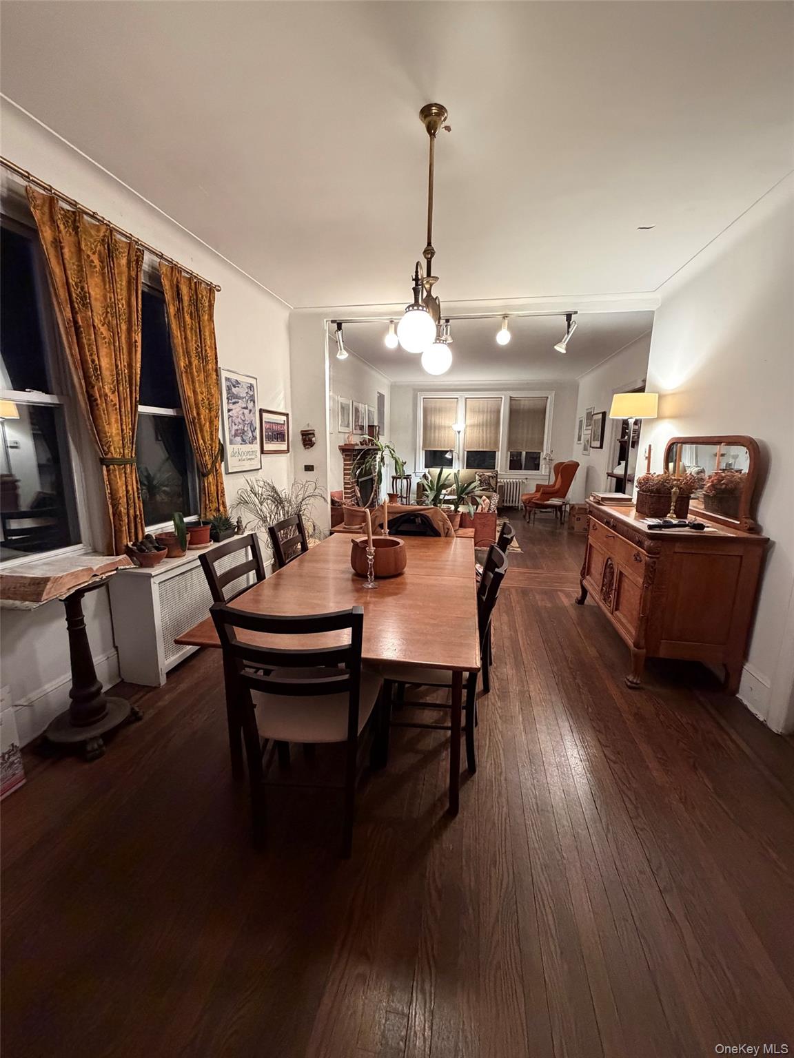 6004 Netherland Avenue Bronx, NY 10471 - Photo 14 of 30 a view of a dining room with furniture window and wooden floor