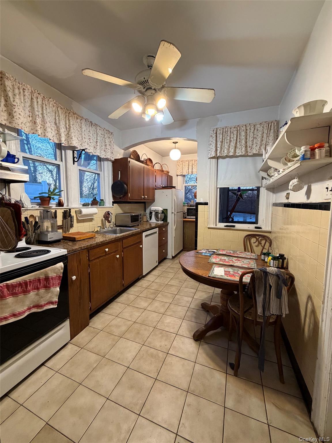 6004 Netherland Avenue Bronx, NY 10471 - Photo 15 of 30 a kitchen with a sink appliances and cabinets