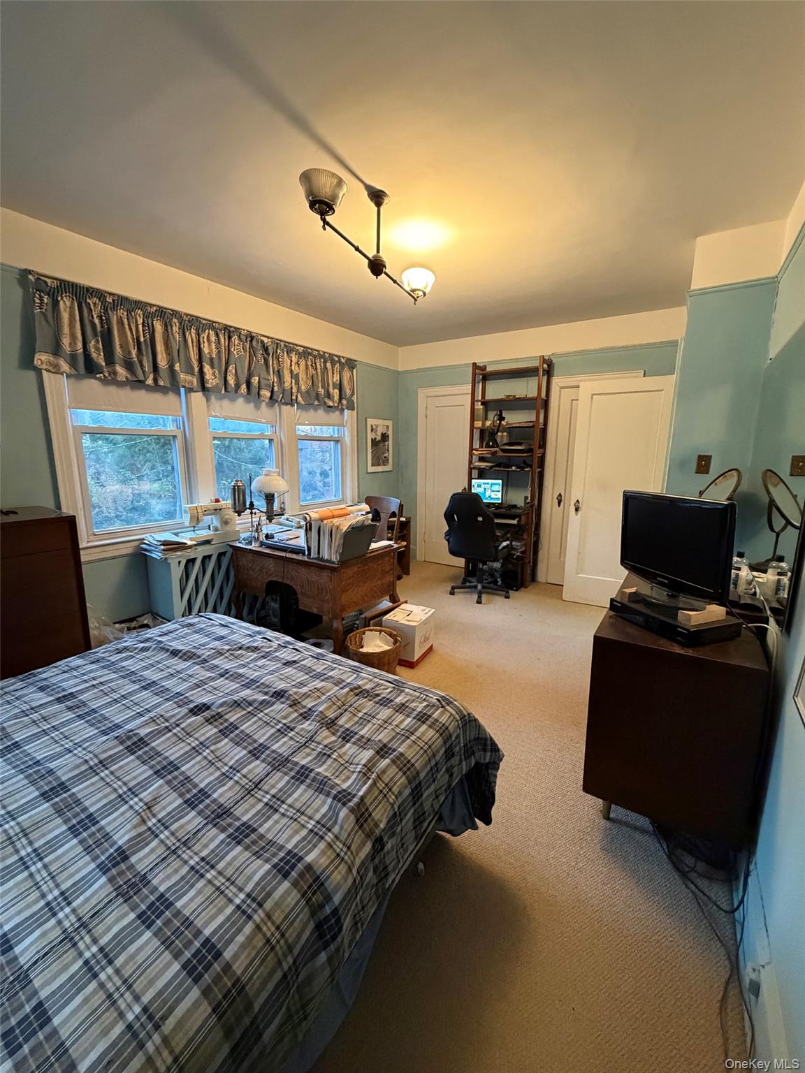 6004 Netherland Avenue Bronx, NY 10471 - Photo 23 of 30 a bedroom with a bed and furniture