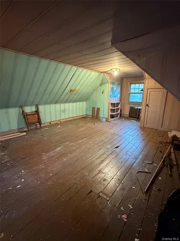 a view of a porch with wooden floor