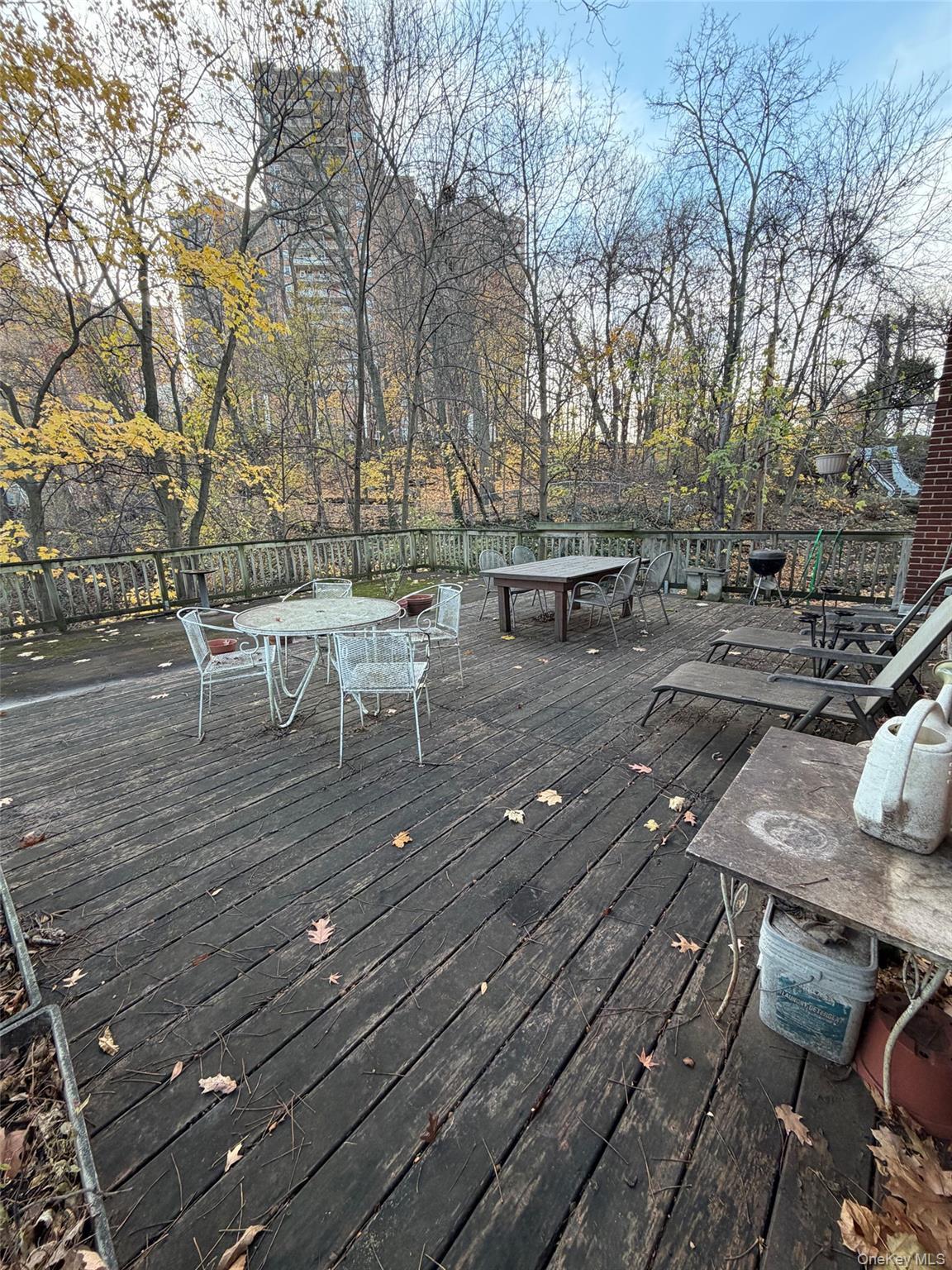 6004 Netherland Avenue Bronx, NY 10471 - Photo 8 of 30 a view of a terrace with chairs and a barbeque