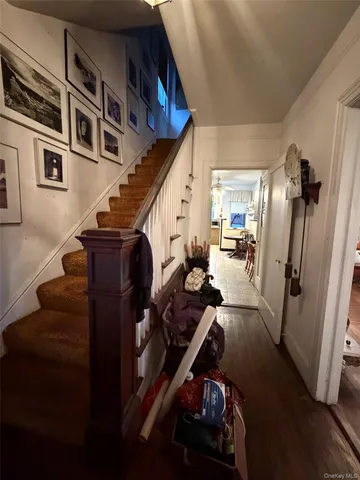 a view of an entryway with wooden floor