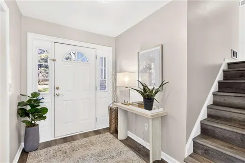 a view of entryway with wooden floor