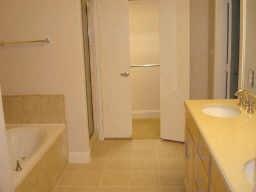 6159 Oram Street, Unit 105 Dallas, TX 75214 - Photo 12 of 16 a bathroom with a tub sink and shower