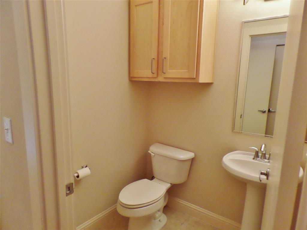 6159 Oram Street, Unit 105 Dallas, TX 75214 - Photo 13 of 16 a bathroom with a toilet sink